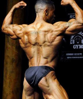 body buider flexing muscles