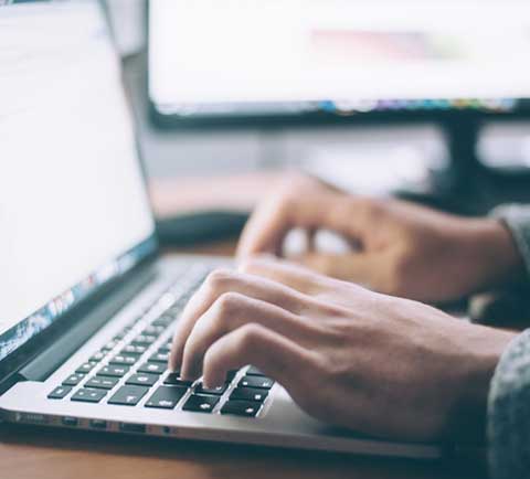 typing on laptop